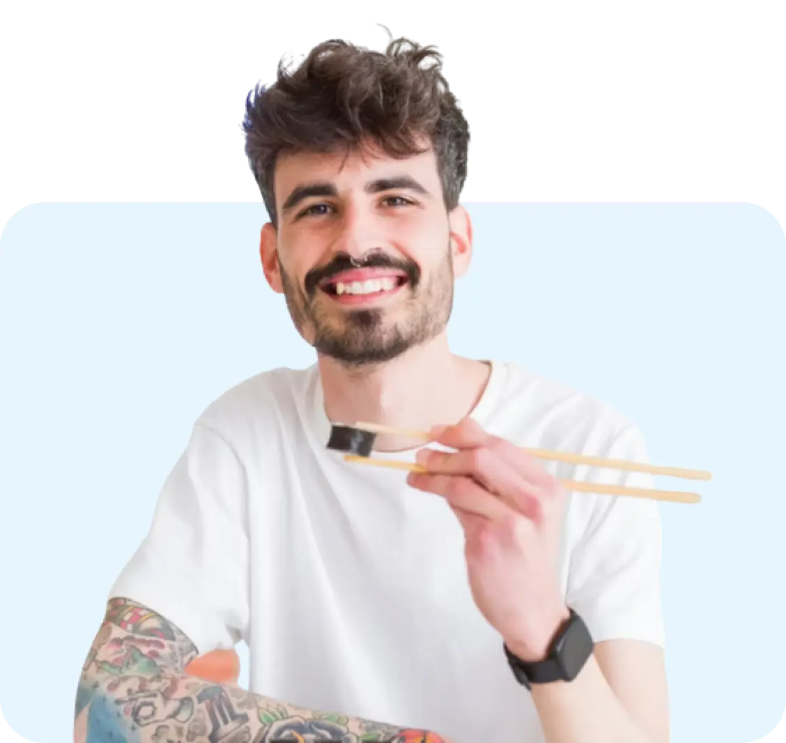 Man eating using chopstix